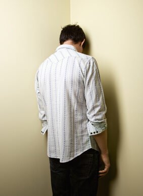Man standing in corner