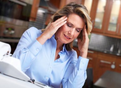 Woman having headache migraine.